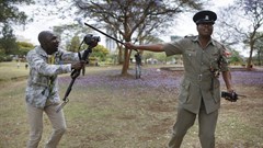 A Kenyan journalist has an altercation with a police officer. EPA/Dai Kurokawa