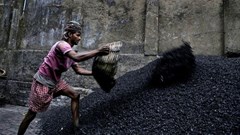A worker makes coal chips for combustion in Calcutta. India’s demand for energy is growing fast. EPA/PIYAL ADHIKARY