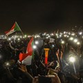 Sudanese protesters are seen with their smartphones in Khartoum on April 21, 2019. CPJ has called on South African telecommunications company MTN Group to end its role in Sudan’s internet shutdowns. Credit: CPJ/AFP/Ozan Kose.