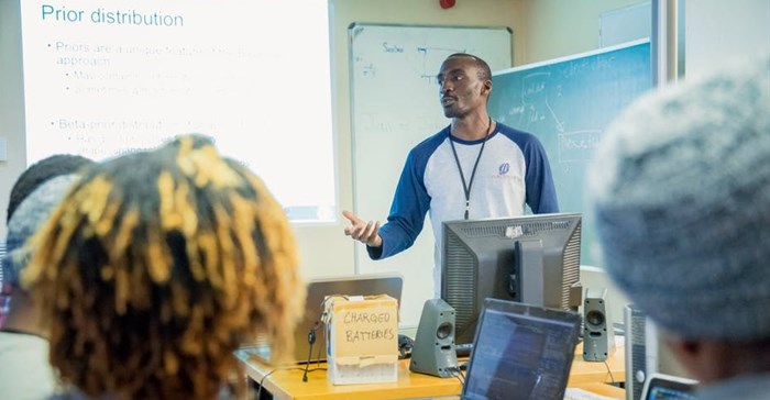 Dr Joseph Sempa of Sacema presenting at the 2019 Clinic on Meaningful Modelling of Epidemiological Data. AIMS-South Africa