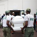Members of the National Youth Service Corp carry the body of their colleague, the reporter Precious Owolabi, in Abuja on July 23. Owolabi was shot while covering protests in the Nigeria capital. Credit: CPJ/AFP/Kola Sulaimon.