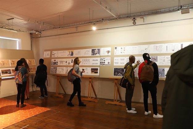 Students study the past architecture honours students’ work that was displayed at the District Six Museum Homecoming Centre. Photo: Michael Hammond/UCT