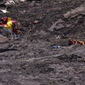 Firefighters search for victims after the Brumandinho tailings dam failure in January 2019. Yuri Edmundo/EPA