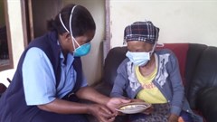 A community care worker providing treatment to a TB patient at her home. Wikkicommons/Stherere23
