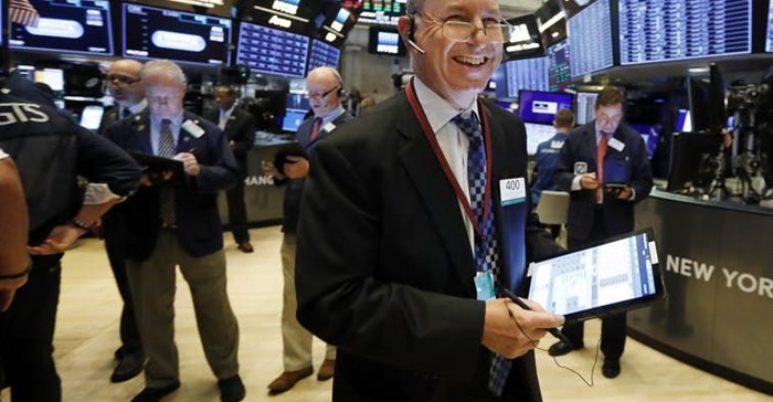 Why is this man smiling? AP Photo/Richard Drew