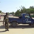 A police officer is seen in N'Djamena, Chad, on July 11, 2015. A N'Djamena court recently charged two Chadian journalists with criminal defamation and sentenced one to jail. Credit: CPJ/Reuters/Moumine Ngarmbassa.