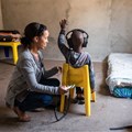 A community health worker screening a child’s hearing in Cape Town. Ora Buerkli