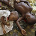 Millions of young children get malaria. These two got it in 2010.
AP Photo/Schalk van Zuydam