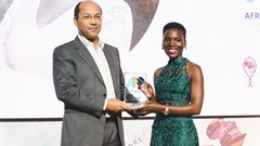 Nila Yasmin, APO Group African Women in Media Award Winner receiving the APO Group African Women in Media Award from Nicolas Ponpigne-mognard, founder and chairman, APO Group