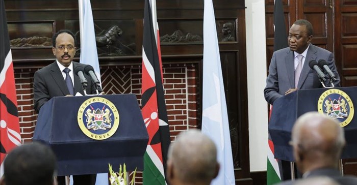 President Mohamed Abdullahi Mohamed of Somalia (left) and Kenya’s President Uhuru Kenyatta.Their countries are in a row over territory. Daniel Irungu/EPA