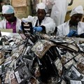 Workers pack coffee sachets at the Dormans coffee factory in Nairobi, Kenya. Credit: The Conversation Africa/EPA/Daniel Irungu.