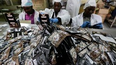 Workers pack coffee sachets at the Dormans coffee factory in Nairobi, Kenya. Credit: The Conversation Africa/EPA/Daniel Irungu.