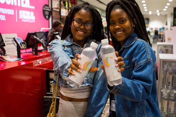 Cotton On ambassadors, the Sobekwa twins, with Cotton On Foundation merchandise.