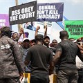 Demonstrators are seen outside the Department of State Services headquarters in Abuja, Nigeria, on November 12, 2019. Police fired on and attacked journalists covering that demonstration. Credit: CPJ/AFP/Kola Sulaimon.