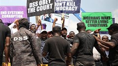 Demonstrators are seen outside the Department of State Services headquarters in Abuja, Nigeria, on November 12, 2019. Police fired on and attacked journalists covering that demonstration. Credit: CPJ/AFP/Kola Sulaimon.