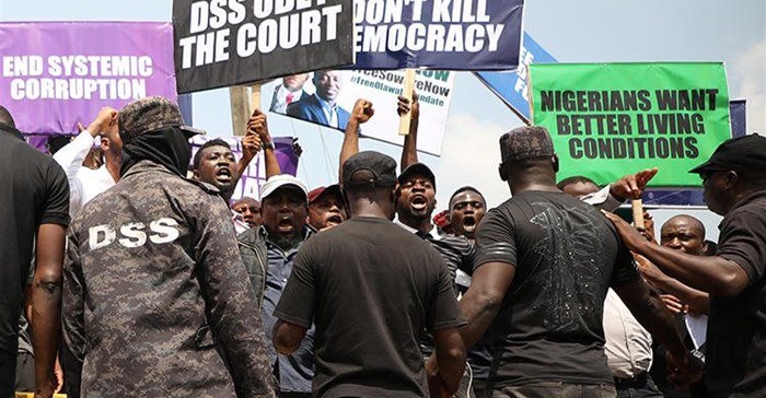 Demonstrators are seen outside the Department of State Services headquarters in Abuja, Nigeria, on November 12, 2019. Police fired on and attacked journalists covering that demonstration. Credit: CPJ/AFP/Kola Sulaimon.