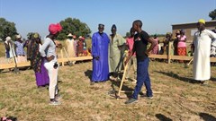 From L-R: The team from buildOn and the village Chief (blue robe) and Iman (white robe) preparing to break ground on the construction of the “GE Switzerland School” that will educate 150 learners from Kaolack.
Source: GE