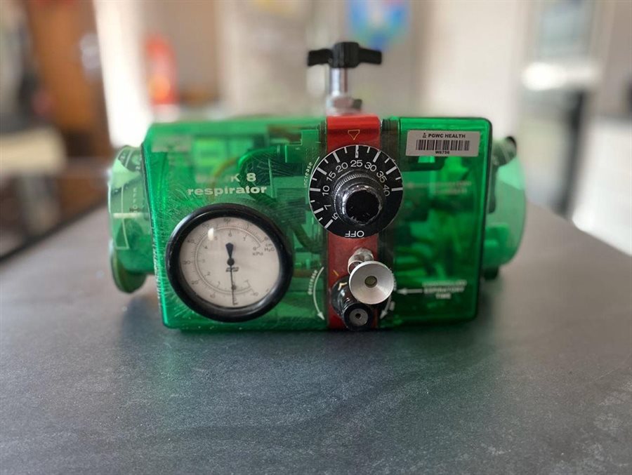 An existing mechanical respirator being reverse-engineered to be used as an emergency ventilator.