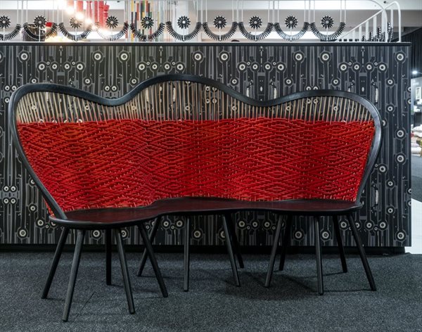 The Hlabisa Bench by Houtlander in collaboration with Mash.T Design, with a backrest handwoven by the master weavers of Hlabisa in rural KwaZulu-Natal.
