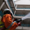 A member of the Nigerian Health Task Force fumigates a building in Abuja, Nigeria, as the city struggles to curb the spread of coronavirus. COVID-19 Photo by Kola Sulaimon/AFP via Getty Images