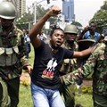 Kenyan activist Boniface Mwangi is arrested during a protest in Nairobi in 2014. AFP via Getty Images.