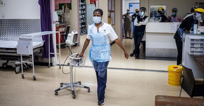 A health worker drags an electrocardiograph at the Charlotte Maxeke Hospital in Johannesburg.<p>Michele SpatariI/AFP via Getty Images
