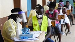 Healthcare workers testing people in Nairobi, Kenya during a mass testing exercise for Covid-19. Photo by SIMON MAINA/AFP via Getty Images