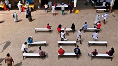 People observing social distancing as they queue for mass testing for the Covid-19 coronavirus in a Nairobi suburb. (Photo by Tony Karumba/AFP via Getty Images)