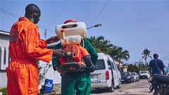Lagos state officials disinfecting roads in the state. Shutterstock