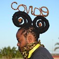 Hair stylist Onele Cembi twists his dreadlocks into the words “Covid-19”. Photo: Thamsanqa Mbovane