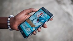 A warning sign advising users to be aware of their surroundings while playing a video game. Stefan Heunis/AFP via Getty Images