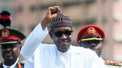 President Muhammadu Buhari raises his fist during an inspection of honour guards on parade to mark Democracy Day in Abuja, on June 12, 2019.
Pius Utomi Ekpei/AFP via Getty Images