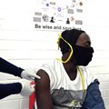 A volunteer receives an injection from a medical worker during the country’s first human clinical trial for a potential vaccine against Covid-19 in Soweto, South Africa. Felix Dlangamandla/Beeld/Gallo Images via Getty Images