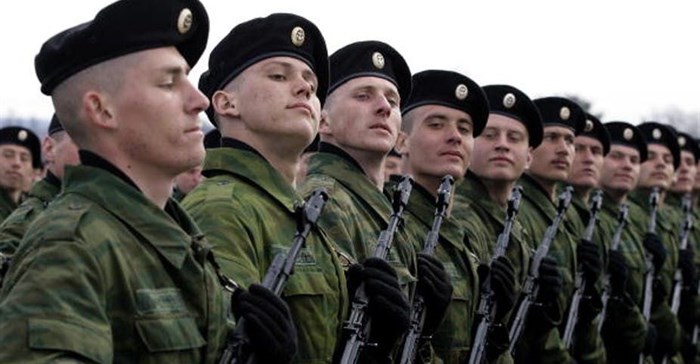 Russian soldiers march during a Victory Day parade. The country makes guns and armoury as its main beneficiation output. Photo by Dmitry Korotayev/Epsilon/Getty Images