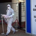A healthcare worker in a protective suit is seen at a quarantine and isolation centre in Johannesburg, South Africa.