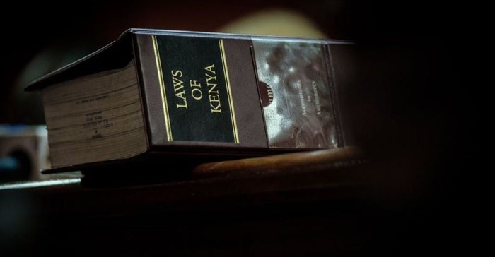 A volume of the Law of Kenya sits on a judge’s desk during trial. Yasuyoshi Chiba/AFP via Getty Images