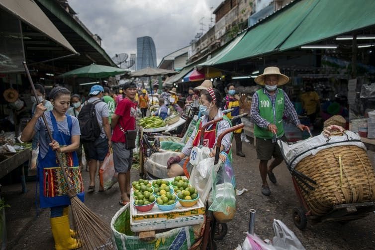 Vendors sell vegetables at a wet market in Bangkok, Thailand. (AP Photo/ Gemunu Amarasinghe)