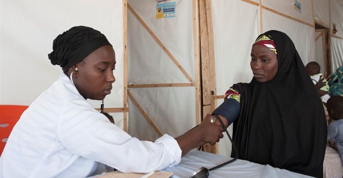 A woman gets her blood pressure checked at a camp for internally displaced people in Maiduguri, north-east Nigeria. Stefan Heunis/AFP via Getty Images