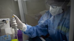 A laboratory technician processes samples for testing Covid-19 at the Rwanda Biomedical Center in Kigali. Simon Wohlfahrt / AFP via Getty