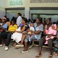 People wait for care at a Kenyan clinic. Photo by Wendy Stone/Corbis via Getty Images