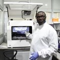 Professor Christian Happi, director of the African Centre of Excellence for Genomics of Infectious Diseases, displays one of the most advanced automated acid extractors being used in the laboratory. Pius Utomi Ekpei/AFP via Getty Images