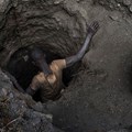 A creuseur or digger, descends into a tunnel at the mine in Kawama, Democratic Republic of Congo. Michael Robinson Chavez/The Washington Post via Getty Images