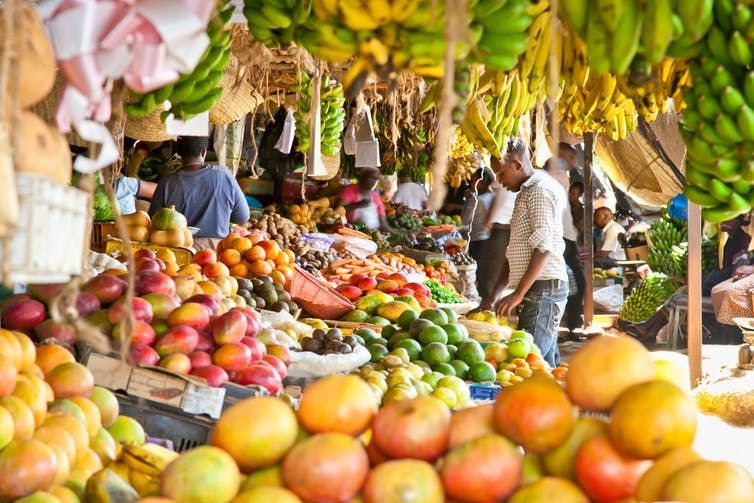 Fruit and vegetables at a market in Kenya. The WHO is pushing for consumption of fresh fruits and vegetables, whole grains, beans, fish and unsaturated fats. Shutterstock