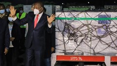 Kenya’s health minister Mutahi Kagwe next to the country’s first batch of Covid-19 vaccines at the Jomo Kenyatta International Airport. EPA-EFE/Daniel Irungu