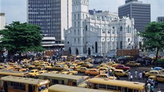 Bank buildings rise above the business district of Lagos. Banks must effectively communicate the impact of their engagement with women. Tim Graham/Getty Images