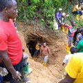 Rescuers work in Kamituga, South Kivu, at the entrance of one of the mines which collapsed following torrential rains trapping dozens of artisanal miners in September 2020. Photo by Stringer/AFP via Getty Images