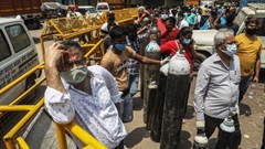 Family members of Covid-19 infected patients stand in a queue with empty oxygen cylinders outside the oxygen filling centre in New Delhi, India. Photo by Naveen Sharma/SOPA Images/LightRocket via Getty Images