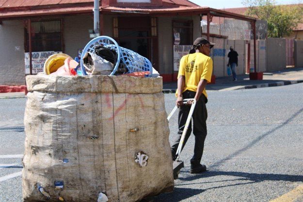 Mokoka Mokoka is a reclaimer with the African Reclaimers Organisation. He says he wakes up at 4am to get to work before Pikitup trucks collect recyclable materials. Photo: Masego Mafata