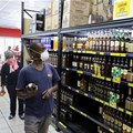 A shopper wearing a protective mask shops for liquor in Johannesburg, South Africa, March 26, 2020. Reuters/Siphiwe Sibeko