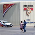A couple leaves Tiger Brands factory shop in Germiston, Johannesburg, South Africa, 5 March 2018. Reuters/Siphiwe Sibeko